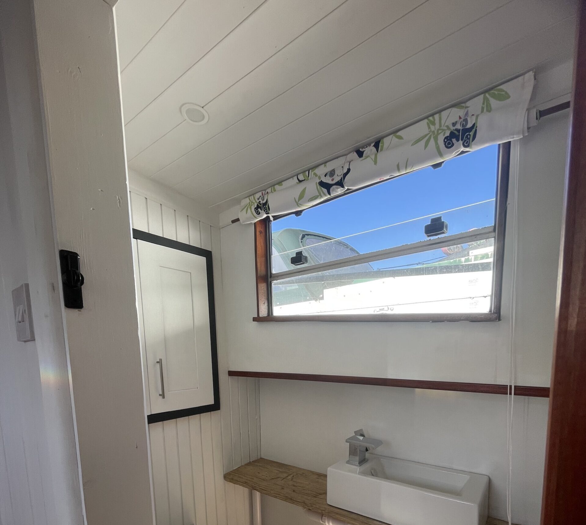 Shower room with composting toilet and basin